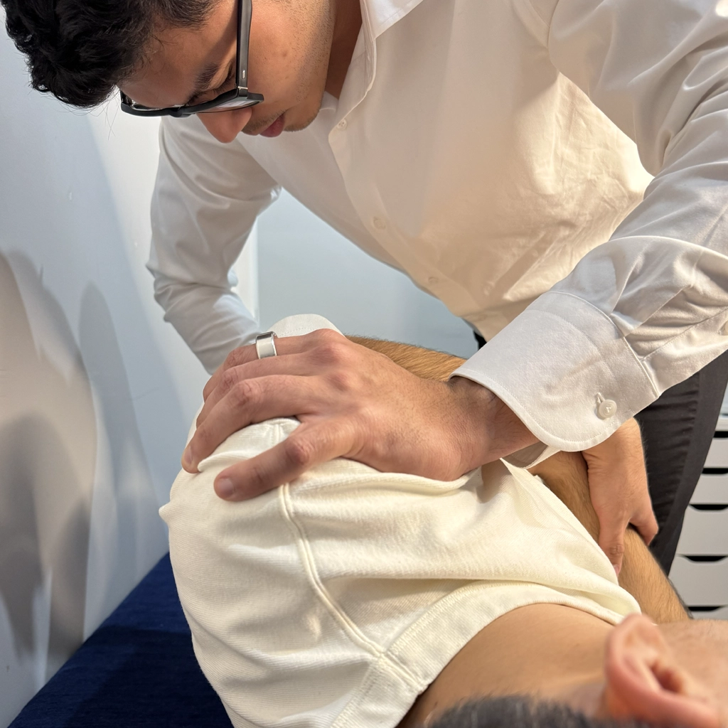 Male patient receiving lumbar adjustment during a Gonstead session at Ringwood Chiro