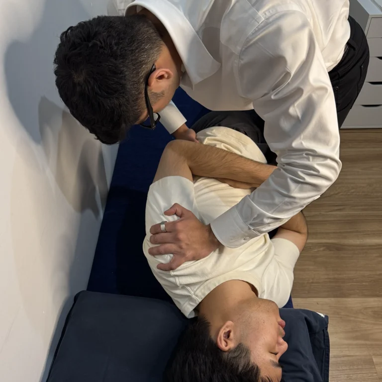 Male patient receiving a lumbar adjustment from a our Ringwood Chiropractic practitioner.