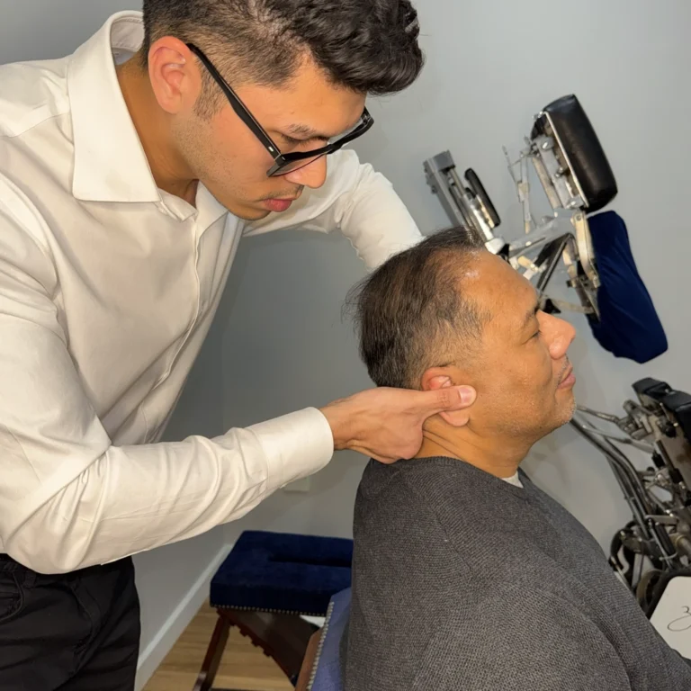 Elderly male patient receiving posture assessment and spinal evaluation before treatment at Ringwood Chiro