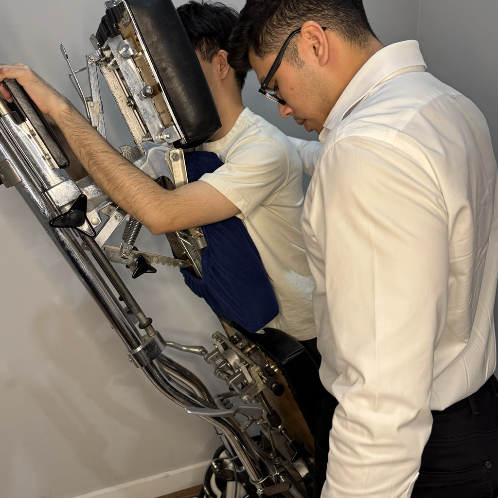 Ringwood chiropractor preparing male patient for a Gondtead spinal adjustment on the adjustment table